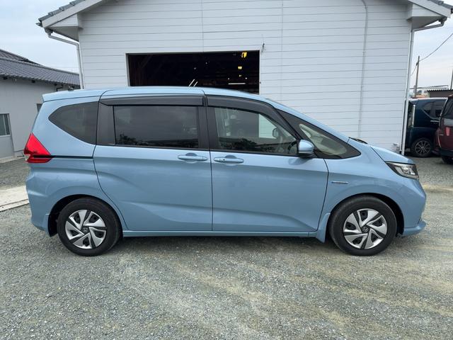 フリードハイブリッド ハイブリッド・Ｇホンダセンシング　キーフリー　プッシュスタート　純正ナビ　フルセグテレビ　ＣＤＤＶＤ再生　ブルートゥースオーディオ　ＥＴＣ　バックカメラ　シートヒーター　両側パワースライドドア　ＬＥＤヘッドライト（6枚目）