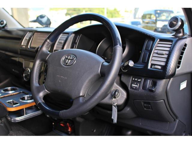 レジアスエースバン ロングスーパーＧＬプライムセレ　・純正ＯＰ７インチワイドＨＤＤナビ・フルセグＴＶ・バックモニター・１１インチフリップダウンモニターＢｌｕｅｔｏｏｔｈ・ＤＶＤ・ＣＤ・ＥＴＣ・ベットキット・スクリーンドア・ハンガーレール・ＨＩＤライト・（36枚目）