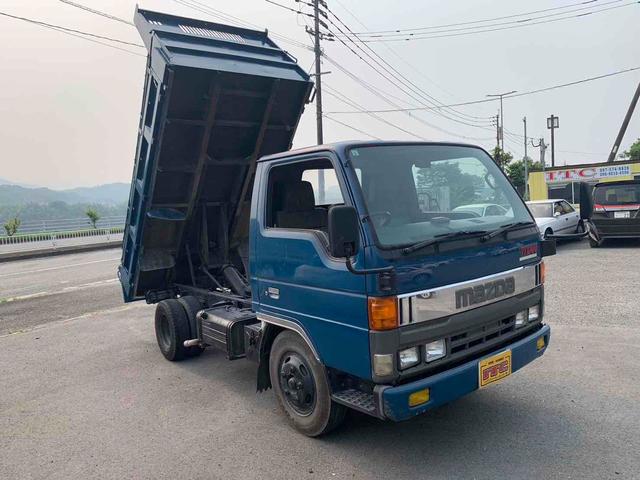 タイタントラック 　ダンプ　ＭＴ　後輪ダブル　エアコン（2枚目）