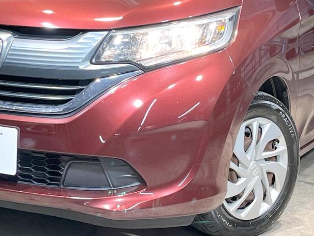 フリード Ｇ・ホンダセンシング　禁煙車　純正ナビ　フリップダウンモニター　バックカメラ　両側パワースライドドア　ホンダセンシング　アダプティブクルーズコントロール　オートエアコン　ＥＴＣ　横滑り防止　スマートキー（14枚目）