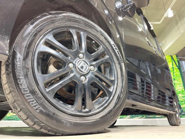 Ｎ－ＢＯＸカスタム Ｇ・Ａパッケージ　電動スライドドア　純正ＳＤナビ　バックカメラ　禁煙車　コーナーセンサー　スマートキー　ＨＩＤヘッドイエローフォグランプ　ＥＴＣ　純正１４インチアルミ　オートエアコン　ＣＤ　ＤＶＤ再生　フルセグ（13枚目）