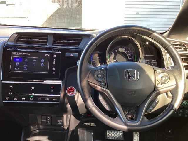 フィットハイブリッド Sホンダセンシング ETC/純正ナビ/バックモニター/ホンダセンシング スマ-トキ- ナビTV アクティブクルーズコントロール パワーウインドウ サイドエアバック DVD再生 パワーステアリング 整備記録簿 ABS(3枚目)