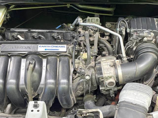 フィットハイブリッド Ｌパッケージ　禁煙車　純正ナビ　バックカメラ　衝突軽減装置　ハーフレザーシート　ＥＴＣ　Ｂｌｕｅｔｏｏｔｈ　フルセグ　ドラレコ　コーナーセンサー　スマートキー　ＬＥＤヘッド　クルコン　電動格納ミラー（18枚目）