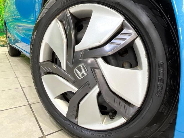 フィットハイブリッド Lパッケージ 禁煙車 純正ナビ バックカメラ 衝突軽減装置 ETC LEDヘッド Bluetooth クルコン ステアリングスイッチ スマートキー オートライト オートエアコン 横滑り防止装置 電動格納ミラー(13枚目)