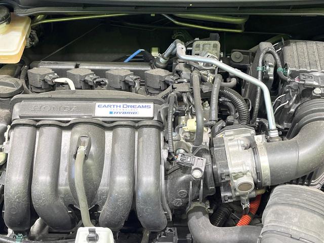 フィットハイブリッド Lパッケージ 禁煙車 純正ナビ バックカメラ 衝突軽減装置 ETC LEDヘッド Bluetooth クルコン ステアリングスイッチ スマートキー オートライト オートエアコン 横滑り防止装置 電動格納ミラー(18枚目)