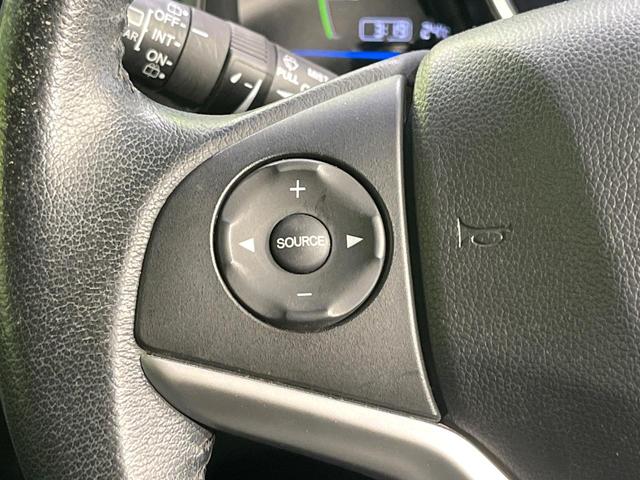 フィットハイブリッド Lパッケージ 禁煙車 純正ナビ バックカメラ 衝突軽減装置 ETC LEDヘッド Bluetooth クルコン ステアリングスイッチ スマートキー オートライト オートエアコン 横滑り防止装置 電動格納ミラー(40枚目)