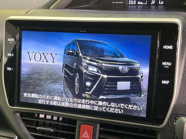ヴォクシー ZS 煌III 純正10型SDナビ 12型後席モニター 両側電動スライドドア バックカメラ 衝突軽減装置 禁煙車 ハーフレザーシート コーナーセンサー スマートキー LEDヘッド ETC クルコン リアオートエアコン(3枚目)