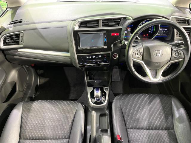 フィットハイブリッド Ｌパッケージ　純正ナビ　バックカメラ　衝突軽減装置　ハーフレザーシート　ＥＴＣ　Ｂｌｕｅｔｏｏｔｈ　フルセグ　ドラレコ　スマートキー　ＬＥＤヘッド　クルーズコントロール　ステアリングスイッチ　オートライト（2枚目）