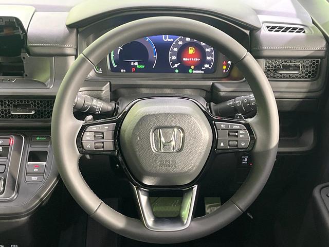 ステップワゴン ｅ：ＨＥＶスパーダ　登録済み未使用車　両側電動スライドドア　レーダークルーズ　電動リアゲート　ハーフレザーシート　コーナーセンサー　スマートキー　ＬＥＤヘッド　純正１６インチアルミ　オートライト　デュアルエアコン（12枚目）