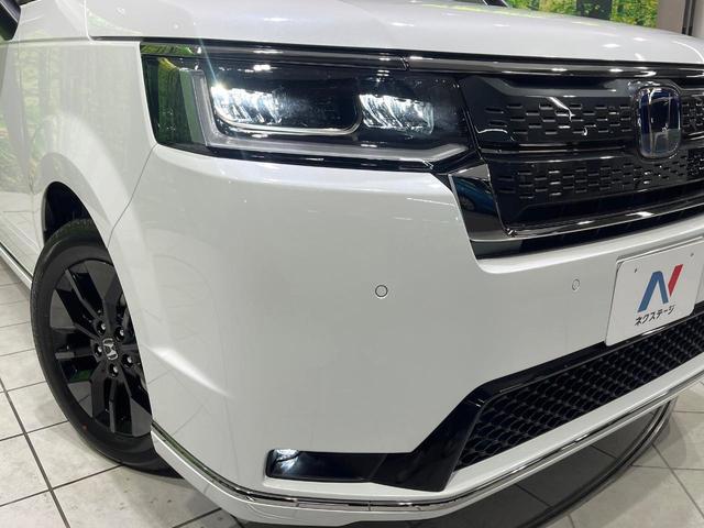 ステップワゴン ｅ：ＨＥＶスパーダ　登録済み未使用車　両側電動スライドドア　レーダークルーズ　電動リアゲート　ハーフレザーシート　コーナーセンサー　スマートキー　ＬＥＤヘッド　純正１６インチアルミ　オートライト　デュアルエアコン（14枚目）