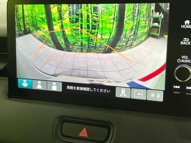 ヴェゼル ｅ：ＨＥＶ　Ｚ　禁煙車　純正９型ナビ　衝突軽減　バックカメラ　レーダークルーズ　ステアリングヒーター　ＥＴＣ　ドラレコ　シートヒーター　電動リアゲート　クリアランスソナー　オートハイビーム　置くだけ充電　スマートキー（4枚目）