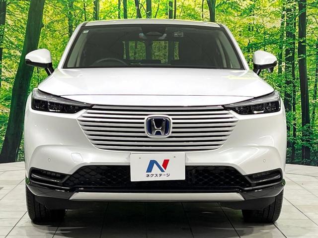 ヴェゼル ｅ：ＨＥＶ　Ｚ　禁煙車　純正９型ナビ　衝突軽減　バックカメラ　レーダークルーズ　ステアリングヒーター　ＥＴＣ　ドラレコ　シートヒーター　電動リアゲート　クリアランスソナー　オートハイビーム　置くだけ充電　スマートキー（14枚目）