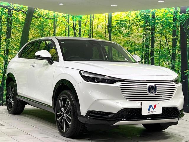 ヴェゼル ｅ：ＨＥＶ　Ｚ　禁煙車　純正９型ナビ　衝突軽減　バックカメラ　レーダークルーズ　ステアリングヒーター　ＥＴＣ　ドラレコ　シートヒーター　電動リアゲート　クリアランスソナー　オートハイビーム　置くだけ充電　スマートキー（16枚目）