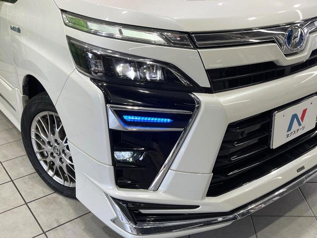 ヴォクシー ハイブリッドＺＳ　煌ＩＩ　禁煙車　モデリスタフルエアロ　衝突被害軽減　純正９型ナビ　バックカメラ　両側電動スライドドア　クルーズコントロール　ＥＴＣ　フルセグ　Ｂｌｕｅｔｏｏｔｈ接続　前席シートヒーター　ＬＥＤヘッドライト（13枚目）