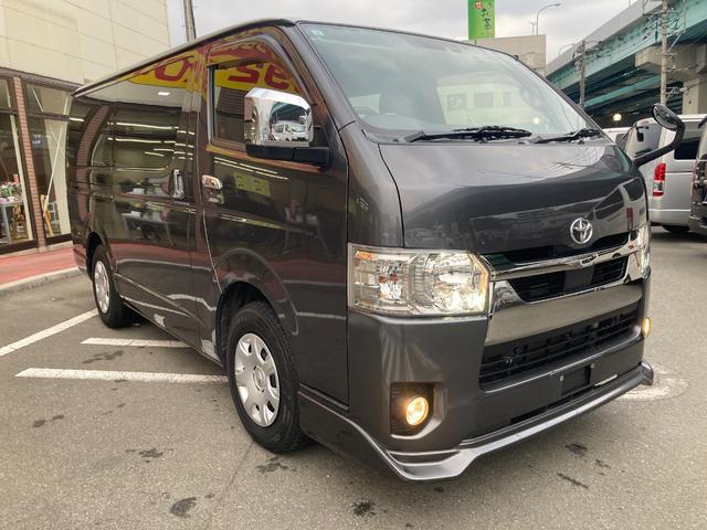ハイエースバン スーパーGL ダークプライムII 6型・トヨタセーフティセンス・クリアランスソナー・LEDヘッドライト・プッシュスタート・フロントスポイラー・ルーフスポイラー・SDナビ・フルセグ・バックカメラ・100V電源・ドラレコ・ルームキャリア(4枚目)