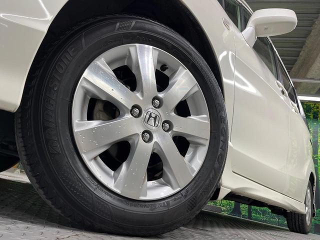 フリードスパイク Ｇ　エアロ　電動スライドドア　ＳＤナビ　禁煙車　スマートキー　ＨＩＤヘッド　ＥＴＣ　オートライト　オートエアコン　純正１５インチアルミ　ＣＤ　ＤＶＤ再生　フルセグ（13枚目）