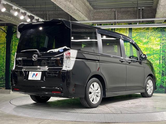 ステップワゴンスパーダ Z 後席モニター 両側電動ドア 純正ナビ バックカメラ 禁煙車 ドラレコ スマートキー HIDヘッド ビルトインETC オートライト オートエアコン 純正16インチアルミ CD DVD再生 フルセグ(18枚目)