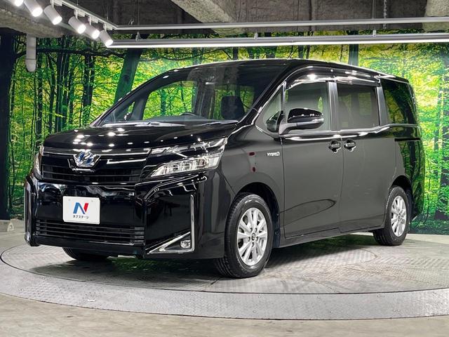 ヴォクシー ハイブリッドＶ　両側電動ドア　純正９インチナビ　バックカメラ　衝突被害軽減システム　レーダークルーズ　禁煙車　スマートキー　ＬＥＤヘッド　ビルトインＥＴＣ　純正１５インチアルミ　車線逸脱警報　シートヒーター（63枚目）