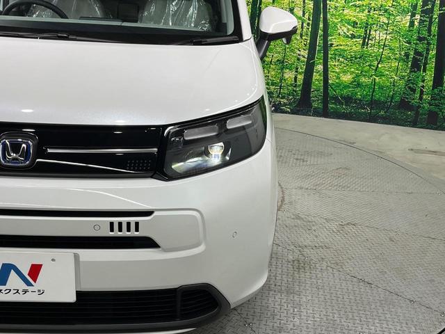 フリード ｅ：ＨＥＶエアー　ＥＸ　登録済未使用車　両側電動ドア　衝突被害軽減システム　コーナーセンサー　スマートキー　ＬＥＤヘッド　純正１５インチアルミ　車線逸脱警報　オートライト　オートエアコン（13枚目）