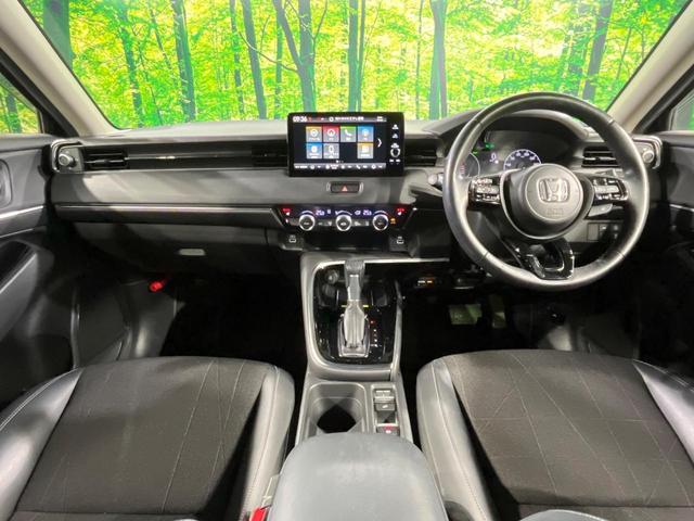 ヴェゼル ｅ：ＨＥＶ　Ｚ　メーカー９インチナビ　バックカメラ　衝突軽減　禁煙車　電動リアゲート　ハーフレザーシート　ドラレコ　コーナーセンサー　スマートキー　ＬＥＤヘッド　ＥＴＣ　純正１８インチアルミ　レーンキープ（2枚目）