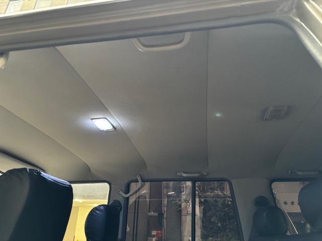 ランドクルーザープラド SXワイド サンドベージュXホワイト ナロー5ナンバー8人乗り ナルディーステア リフトアップ 70メッキバンパー 社外オーディオ ETC ドライブレコーダー バックカメラ 黒革調シートカバー ジオランダーAT(36枚目)