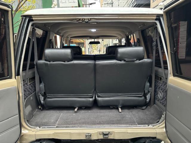 ランドクルーザープラド SXワイド サンドベージュXホワイト ナロー5ナンバー8人乗り ナルディーステア リフトアップ 70メッキバンパー 社外オーディオ ETC ドライブレコーダー バックカメラ 黒革調シートカバー ジオランダーAT(37枚目)