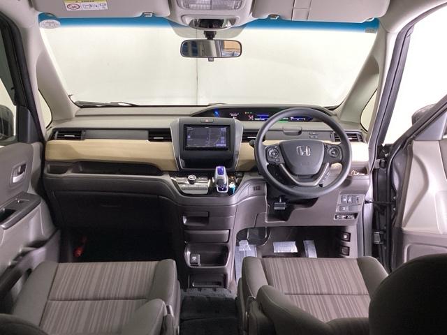 フリードハイブリッド ハイブリッド・Ｇホンダセンシング　ナビ　Ｒカメラ　ブルートゥース　フルセグ　キーフリーシステム　記録簿　ＥＣＯＮ　後カメラ　Ａクルーズ　ＬＥＤヘッドランプ　横滑防止　パワーウインドウ　ＥＴＣ付　両席エアバック　エアバッグ　パワステ（2枚目）