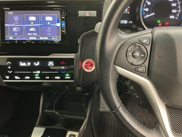 フィットハイブリッド Ｌホンダセンシング　ドラレコ　ナビ　Ｒカメラ　ブルートゥース　軽減ブレーキ　ＬＥＤ　サイドＳＲＳ　横滑り防止　ドライブレコーダー　フルセグテレビ　記録簿　パワーステアリング　盗難防止装置　オートクルーズ　ＥＴＣ車載器（3枚目）