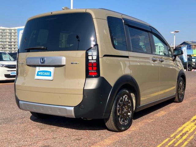 フリード eHEVクロスター 新品タイヤ/保証書/純正 11インチ SDナビ/ホンダセンシング/両側電動スライドドア/シートヒーター/マルチビューカメラシステム/車線逸脱防止支援システム/シート ハーフレザー 衝突被害軽減システム(3枚目)