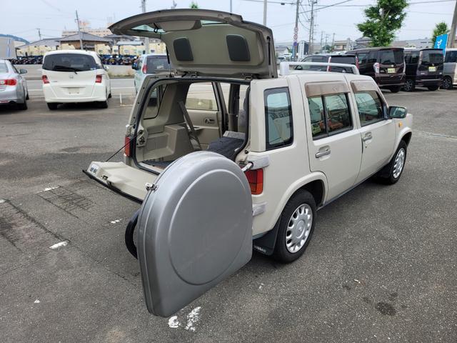 ラシーン タイプＭ　最終型　特別仕様車　羅針盤デザインシート　木目調パネル　背面タイヤ＆ハードカバー　ルーフレール　ＥＴＣ　タイミングチェーン式　キーレス　ＣＤステレオ　４ＷＤ　日産ディーラー仕入れ（11枚目）