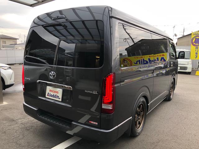 ハイエースバン スーパーGL ダークプライムII ワンオーナー 11インチナビ 地デジ パノラミックビューモニター LEDヘッドライト トヨタセーフティーセンス 両側パワースライドドア BLITZスポイラー ゲンブローダウン BACK9フェンダー(4枚目)