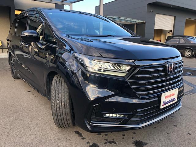 オデッセイハイブリッド ｅ：ＨＥＶアブソルート・ＥＸブラックエディション　ワンオーナー　純正９型ナビ　地デジ　マルチビューカメラ　ＬＥＤヘッドライト　ホンダセンシング　ブラインドスポットインフォメーション　パワーテールゲート　２列目シートヒーター　ワイヤレス充電器　ＥＴＣ（2枚目）