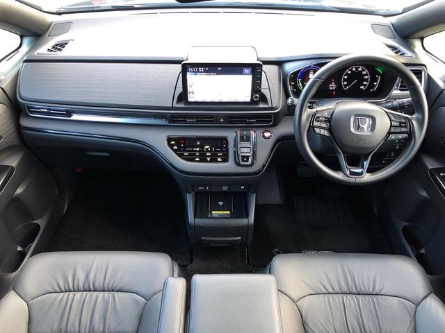 オデッセイハイブリッド ｅ：ＨＥＶアブソルート・ＥＸブラックエディション　ワンオーナー　純正９型ナビ　地デジ　マルチビューカメラ　ＬＥＤヘッドライト　ホンダセンシング　ブラインドスポットインフォメーション　パワーテールゲート　２列目シートヒーター　ワイヤレス充電器　ＥＴＣ（9枚目）