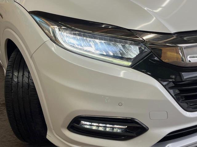 ヴェゼル ハイブリッドＺ・ホンダセンシング　禁煙車　純正ＳＤナビ　バックカメラ　レーダークルーズコントロール　ホンダセンシング　シートヒーター　ＥＴＣ　１７インチ純正アルミ　左右独立オートエアコン　ブラウン革ファブリックコンビシート　トノカバー（14枚目）