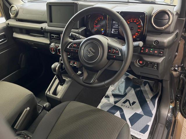 ジムニーノマド ＦＣ　登録済未使用車　４ＷＤ　４ＡＴ　スズキセーフティーサポート　シートヒーター　純正革巻きステアリング　１５インチ純正アルミ　ＬＥＤヘッド　ヘッドライトウォッシャー　衝突軽減装備　車線逸脱警告装備（21枚目）