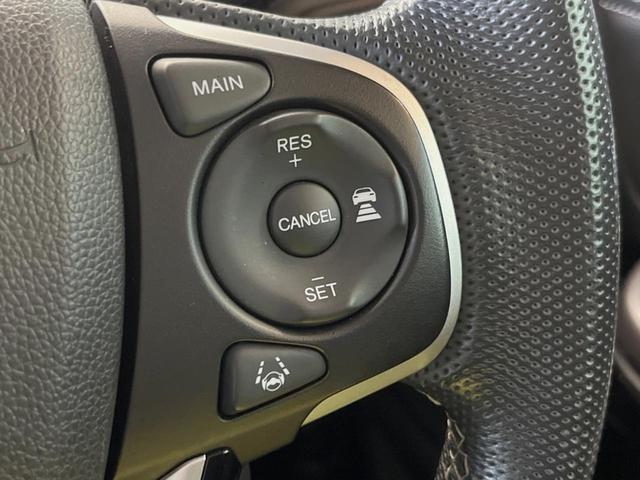 フリードハイブリッド ハイブリッド・モデューロX ホンダセンシング 純正ナビ バックカメラ ホンダセンシング レーダークルーズ 両側パワスラ ハーフレザーシート LEDヘッド 純正15インチアルミ オートエアコン オートライト 純正革巻きステアリング スマートキー(5枚目)