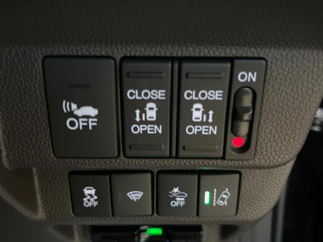 フリードハイブリッド ハイブリッド・モデューロX ホンダセンシング 純正ナビ バックカメラ ホンダセンシング レーダークルーズ 両側パワスラ ハーフレザーシート LEDヘッド 純正15インチアルミ オートエアコン オートライト 純正革巻きステアリング スマートキー(6枚目)