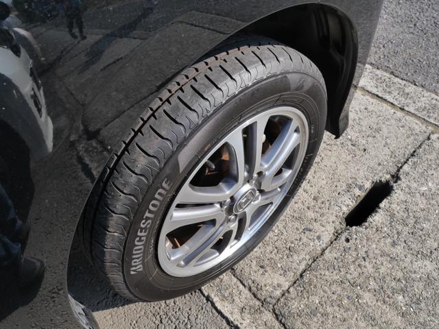 N-BOXカスタム G・Lパッケージ スマートキー プッシュスタート ナビ フルセグ 左側電動スライドドア ETC 電動格納ミラー トラクションコントロール 純正14インチアルミホイール レザー調シートカバー(9枚目)