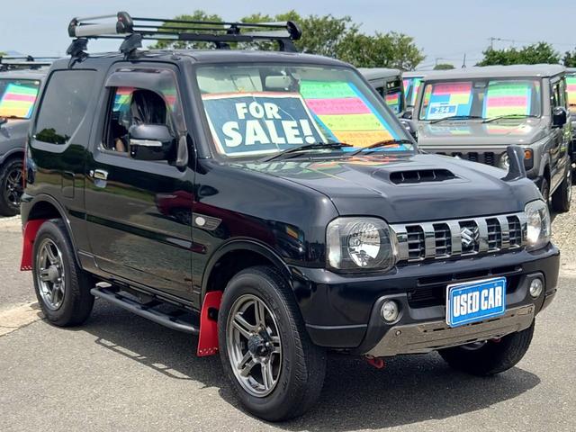ジムニー ランドベンチャー　１０型ＡＴ　４ＷＤ　メモリーナビ　記録簿　レザーシート　シートヒーター　ドラレコ　フルセグＴＶ　ＥＴＣ　ＤＶＤ再生　ツイーター　けん引フック　ルーフキャリア　サイドガード　マッドガード　ターボ　革巻ハンドル　背面カバー　フォグ　電格ミラー（6枚目）