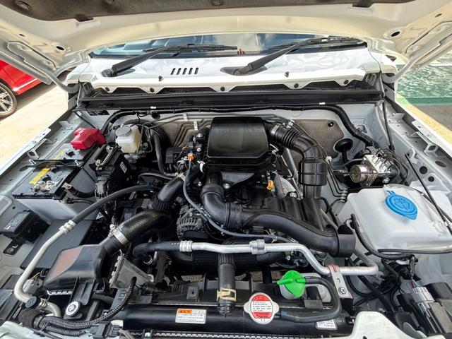 ジムニー ＸＣ　４ＷＤ　ＡＴ　届出済未使用車　衝突軽減ブレーキ　コーナーセンサー　レーン逸脱警報　クルーズコントロール　シートヒーター　ターボ　ＬＥＤヘッドライト　フォグ　純正１６ＡＷ　革巻ハンドル　スマートキー　電格ミラー　集中ドアロック　アイドリングストップ（21枚目）