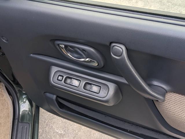 ジムニー ランドベンチャー　４ＷＤ　１０型５ＭＴ　ＳＤナビ　フルセグ　Ｂｌｕｅｔｏｏｔｈ　ＥＴＣ　記録簿　キーレス　ＤＶＤ再生　シートヒーター　ステリモ　ターボ　電格ミラー　フォグライト　革巻ハンドル　ドアバイザー　純正１６ＡＷ　背面タイヤカバー　光軸調整ライト（65枚目）