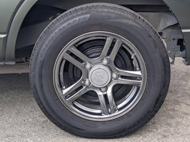 ジムニー ランドベンチャー　４ＷＤ　１０型ＡＴ　レザーシート　シートヒーター　フォグライト　ＥＴＣ　キーレス　電格ミラー　革巻ハンドル　ターボ　ドアバイザー　背面タイヤカバー　ミラーヒーター　フェンダーミラー　光軸調整ライト　純正１５ＡＷ　エアバック（52枚目）