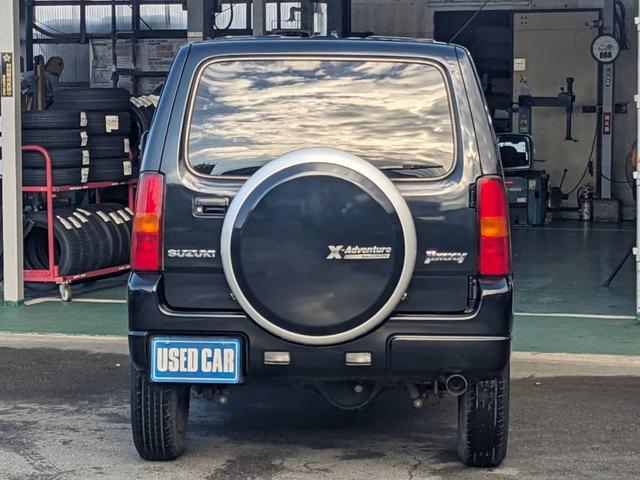 ジムニー クロスアドベンチャーＸＣ　４ＷＤ　８型５ＭＴ　ＳＤナビ　ＨＫＳ社外マフラー　ハーフレザーシート　シートヒーター　革巻ハンドル　背面タイヤカバー　純正１６ＡＷ　フォグライト　キーレス　ターボ　パワーウィンドウ　ミラーヒーター　電格ミラー　光軸調整ライト（7枚目）