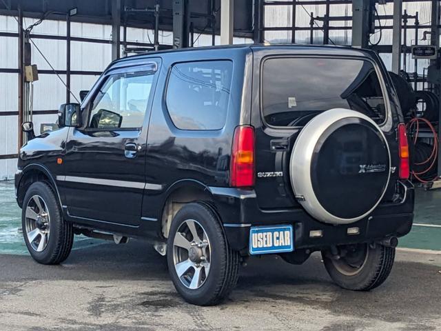 ジムニー クロスアドベンチャーＸＣ　４ＷＤ　８型５ＭＴ　ＳＤナビ　ＨＫＳ社外マフラー　ハーフレザーシート　シートヒーター　革巻ハンドル　背面タイヤカバー　純正１６ＡＷ　フォグライト　キーレス　ターボ　パワーウィンドウ　ミラーヒーター　電格ミラー　光軸調整ライト（8枚目）