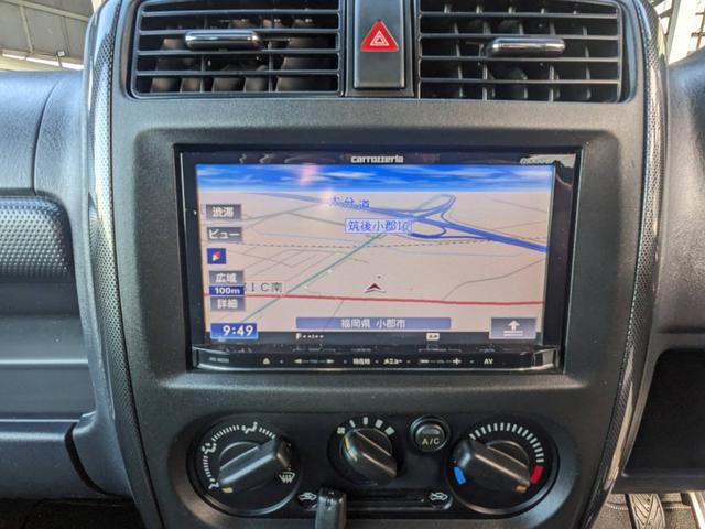 ジムニー クロスアドベンチャーＸＣ　４ＷＤ　８型５ＭＴ　ＳＤナビ　ＨＫＳ社外マフラー　ハーフレザーシート　シートヒーター　革巻ハンドル　背面タイヤカバー　純正１６ＡＷ　フォグライト　キーレス　ターボ　パワーウィンドウ　ミラーヒーター　電格ミラー　光軸調整ライト（19枚目）