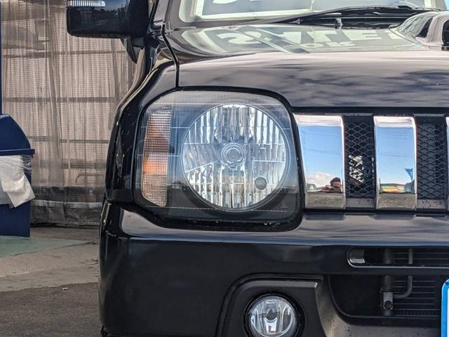 ジムニー クロスアドベンチャーＸＣ　４ＷＤ　８型５ＭＴ　ＳＤナビ　ＨＫＳ社外マフラー　ハーフレザーシート　シートヒーター　革巻ハンドル　背面タイヤカバー　純正１６ＡＷ　フォグライト　キーレス　ターボ　パワーウィンドウ　ミラーヒーター　電格ミラー　光軸調整ライト（26枚目）