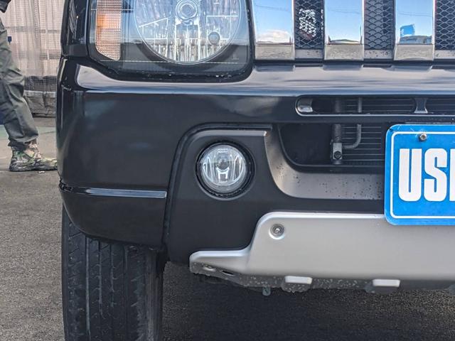 ジムニー クロスアドベンチャーＸＣ　４ＷＤ　８型５ＭＴ　ＳＤナビ　ＨＫＳ社外マフラー　ハーフレザーシート　シートヒーター　革巻ハンドル　背面タイヤカバー　純正１６ＡＷ　フォグライト　キーレス　ターボ　パワーウィンドウ　ミラーヒーター　電格ミラー　光軸調整ライト（28枚目）