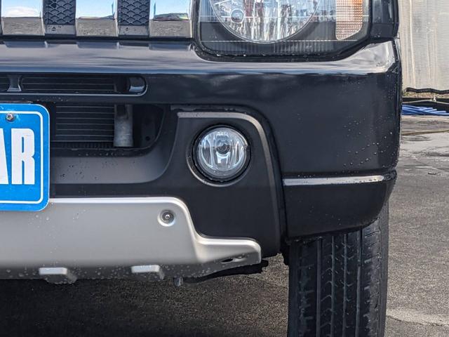 ジムニー クロスアドベンチャーＸＣ　４ＷＤ　８型５ＭＴ　ＳＤナビ　ＨＫＳ社外マフラー　ハーフレザーシート　シートヒーター　革巻ハンドル　背面タイヤカバー　純正１６ＡＷ　フォグライト　キーレス　ターボ　パワーウィンドウ　ミラーヒーター　電格ミラー　光軸調整ライト（29枚目）