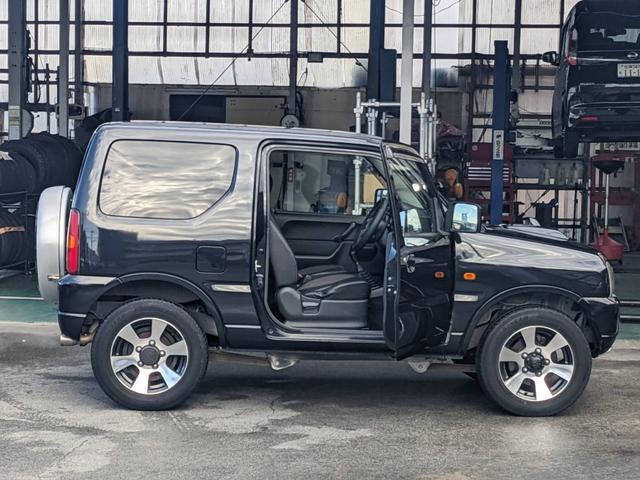 ジムニー クロスアドベンチャーＸＣ　４ＷＤ　８型５ＭＴ　ＳＤナビ　ＨＫＳ社外マフラー　ハーフレザーシート　シートヒーター　革巻ハンドル　背面タイヤカバー　純正１６ＡＷ　フォグライト　キーレス　ターボ　パワーウィンドウ　ミラーヒーター　電格ミラー　光軸調整ライト（36枚目）