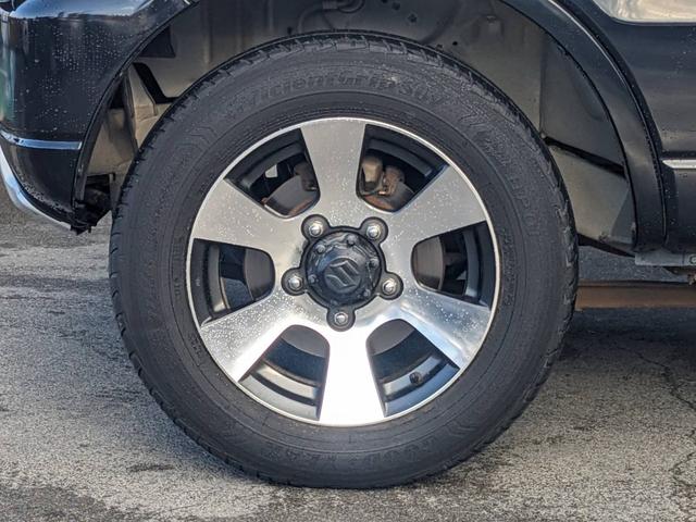 ジムニー クロスアドベンチャーＸＣ　４ＷＤ　８型５ＭＴ　ＳＤナビ　ＨＫＳ社外マフラー　ハーフレザーシート　シートヒーター　革巻ハンドル　背面タイヤカバー　純正１６ＡＷ　フォグライト　キーレス　ターボ　パワーウィンドウ　ミラーヒーター　電格ミラー　光軸調整ライト（49枚目）